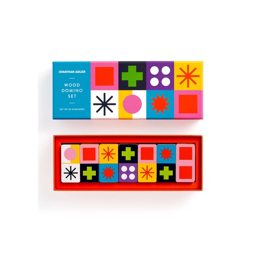 Jonathan Adler Wood Domino Set with its colorful geometric patterned box and three wooden domino pieces displayed on a clean white 