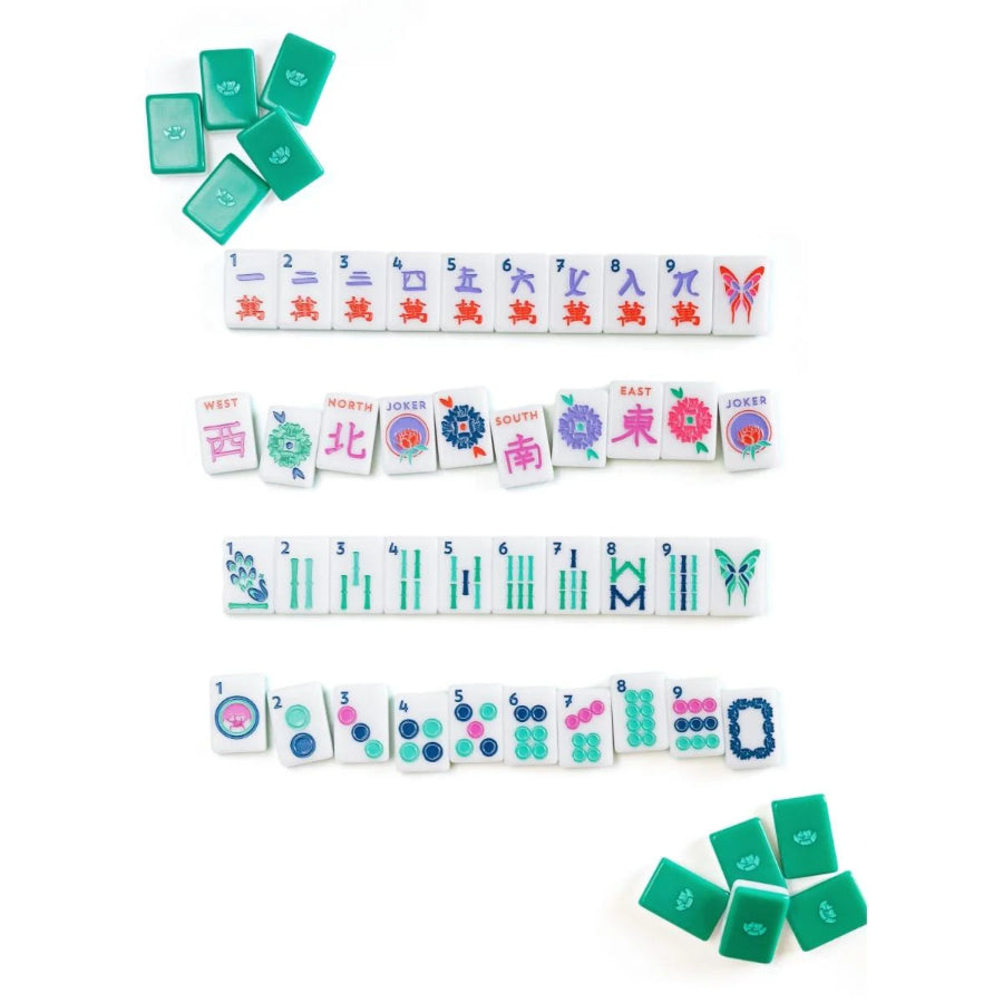 Collection of colorful mahjong tiles on a white background