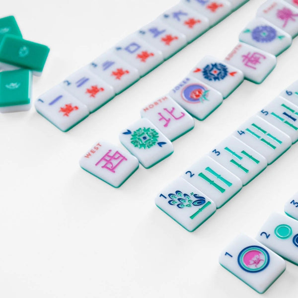 Collection of colorful mahjong tiles on a white background