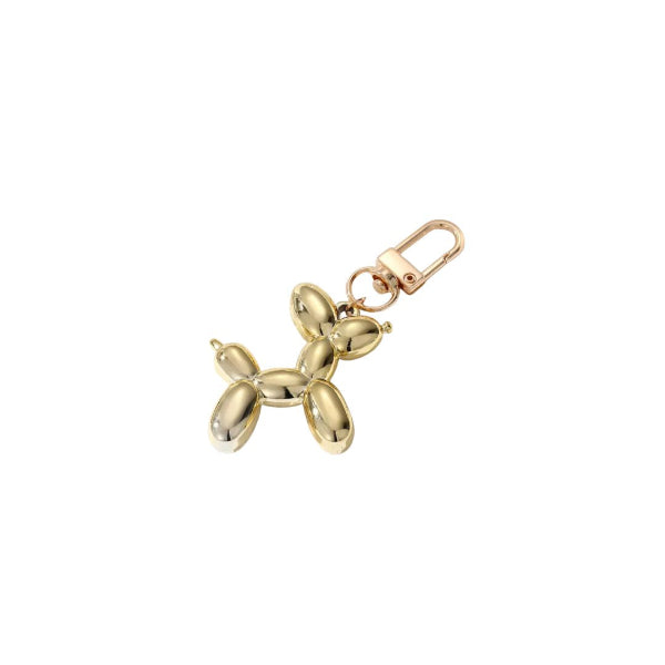 Gold balloon dog keychain on a white background