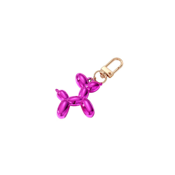 Pink balloon dog charm with gold clasp on a white background