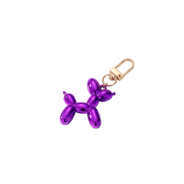 Purple balloon dog keychain with gold clasp on a white background