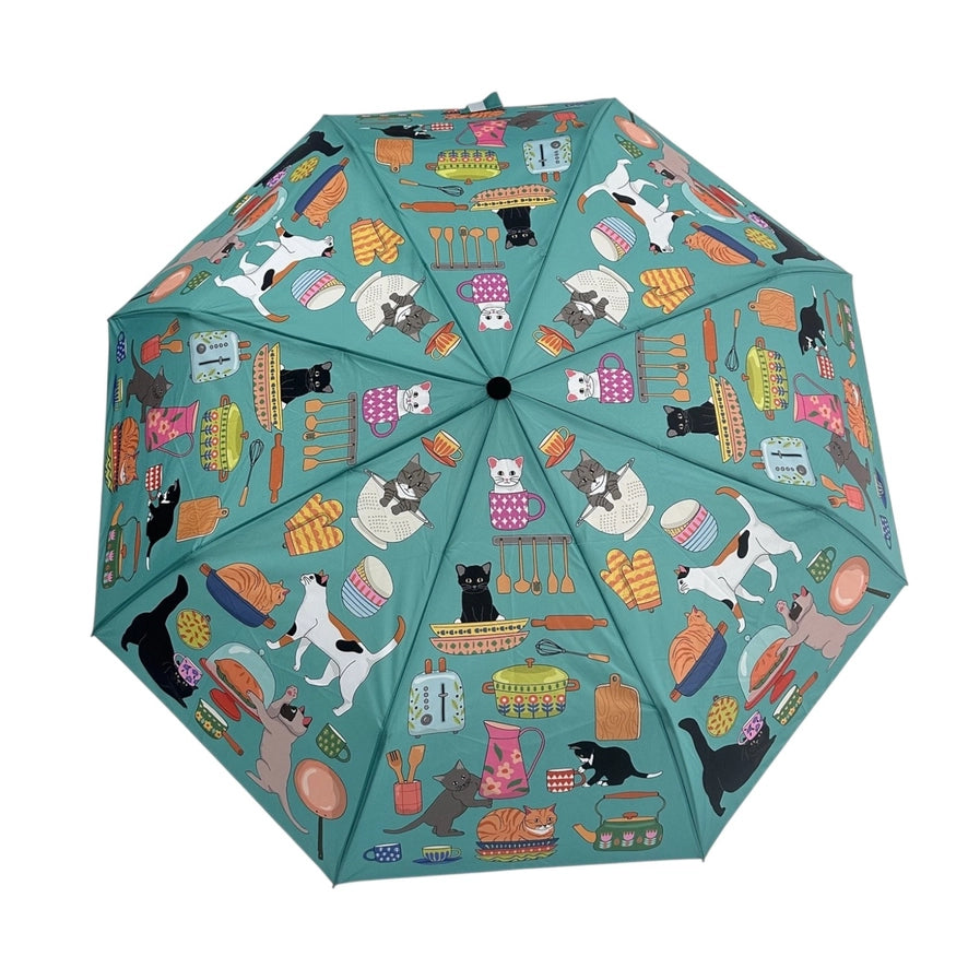 Colorful umbrella with a pattern of cats and various items on a white background