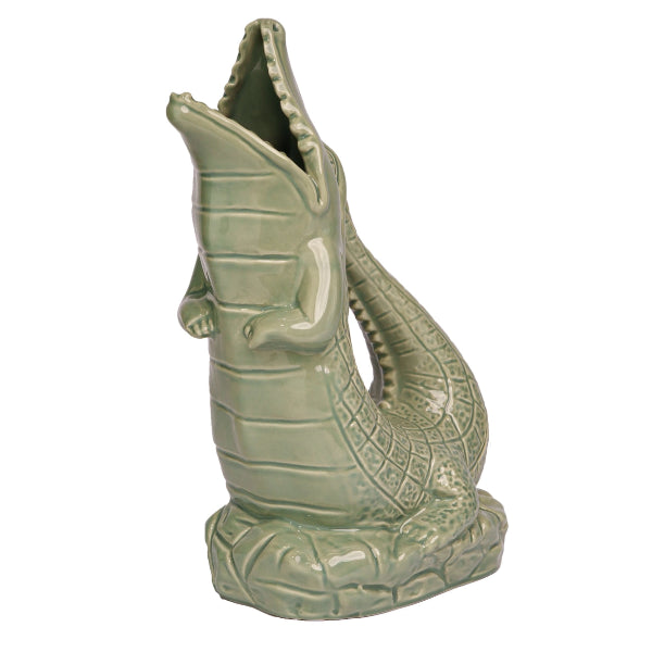 Green ceramic alligator vase on a white background