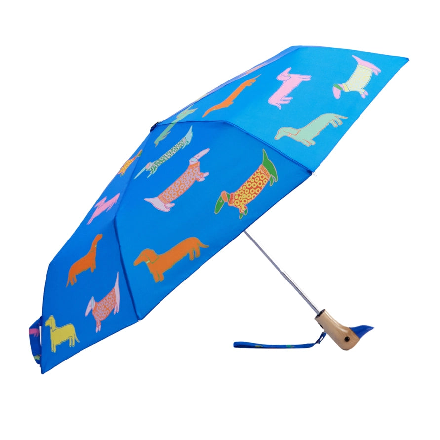 Blue umbrella with colorful dog pattern on a white background