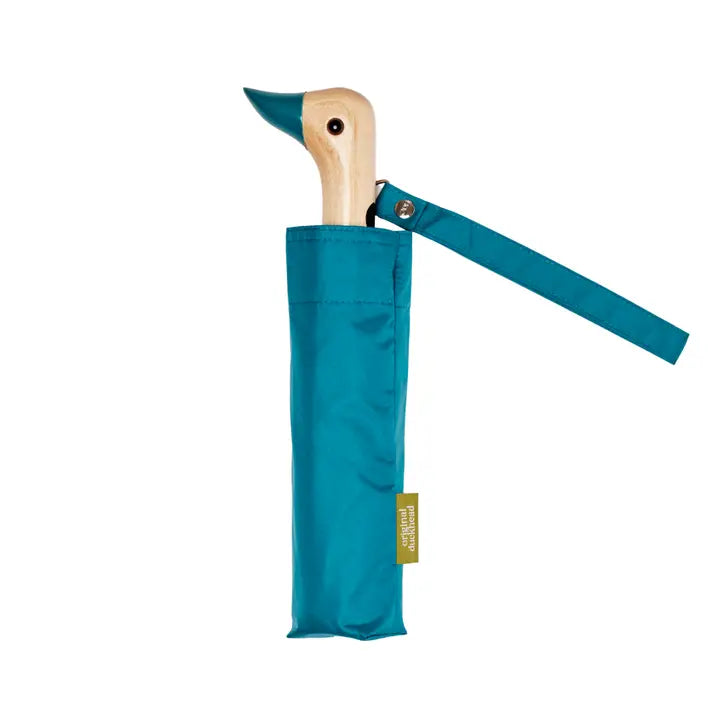 Teal umbrella with wooden duck handle on a white background