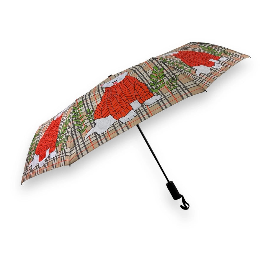 side view of westie dogs umbrella