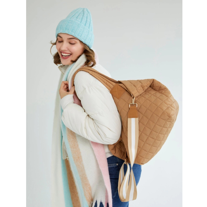 Woman wearing a light blue knit hat 